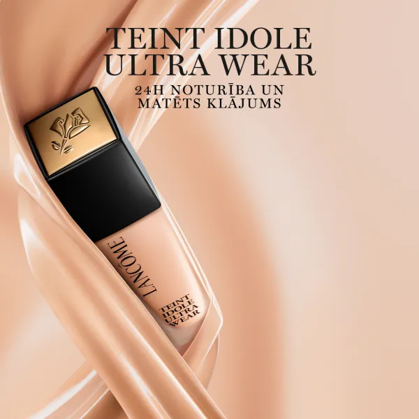 Lancôme Teint Idole Ultra Wear tonālais krēms uz bēša fona ar zīdainu tekstūru.